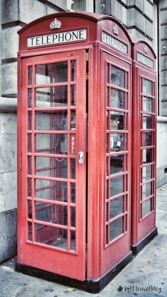 A red telephone box on the streets of London.